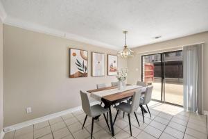 a dining room with a table and chairs at Montrose 2-Unit Retreat 4BR Sleeps 20 Near DT in Houston