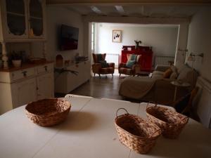 two baskets sitting on a table in a living room at El Sol del Membrillo in Corera