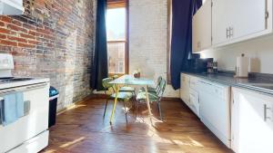 A kitchen or kitchenette at The Lofts at 107