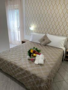 A bed or beds in a room at B&B Via del Sole