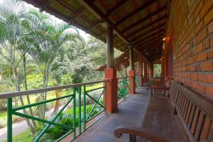 En balkong eller terrasse på Bovera Orchards Coorg By Luxdens Hotels