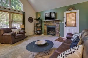a living room with a couch and a fireplace at Mango Mountain House Pocono in Albrightsville