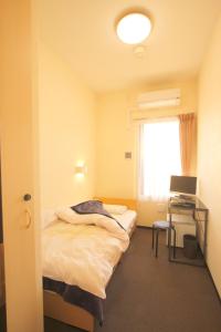 Cama o camas de una habitación en Hotel Palace Japan