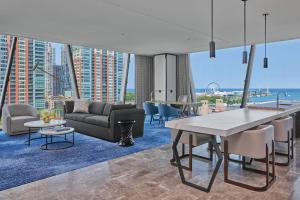 a living room with a couch and a table at The St. Regis Chicago in Chicago