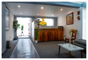 a lobby with a reception desk and a waiting room at LA TERRAZA INN in Huancavelica