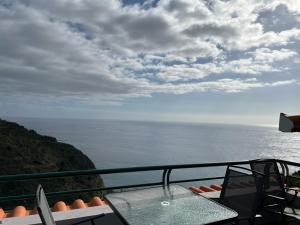 a view of the ocean from a balcony at Pana House in Calheta