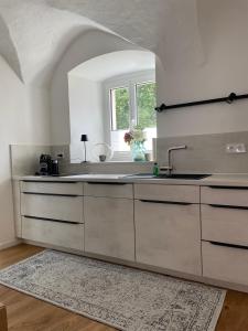 a kitchen with a sink and a window at schloss1 in Selb