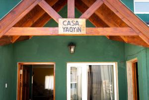 a sign that says casa xatown on a green house at Casa Yaoyín in El Chalten