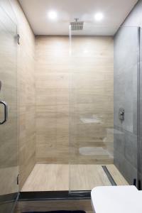 a shower with a glass door in a bathroom at 1597-12 NEW Studio Prime UES WD in unit in New York