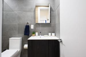 a bathroom with a sink and a toilet at 1597-12 NEW Studio Prime UES WD in unit in New York