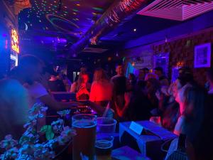 a group of people sitting in a bar at BunkHouse in Cardiff