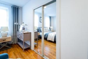 a large mirror in a bedroom with a bed at 350-GA Spacious Studio Gramercy Sleeps3 in New York