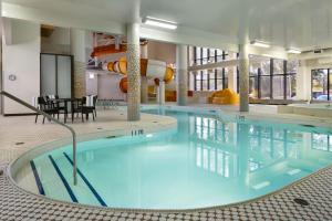 a large swimming pool in a hotel room at Delta Hotels by Marriott Saskatoon Downtown in Saskatoon