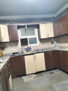 a kitchen being remodeled with a sink and a window at شقة ايجار مفروش 4 نوم 3 حمام 4 ريسيبشن in Cairo