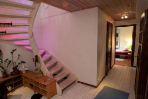 a spiral staircase in a room with a bedroom at Villa Livslust Trollbäcken uthyrning pågår in Tyresö