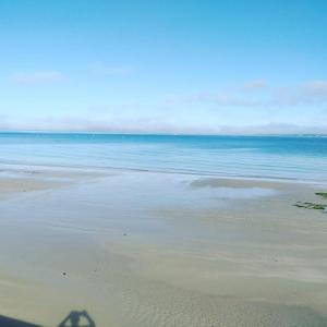 a shadow of a person on the beach at Little Bassett Bed & Breakfast in Totland