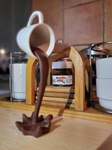 a spoon of chocolate on top of a table at Home Sweet Home in Bareggio