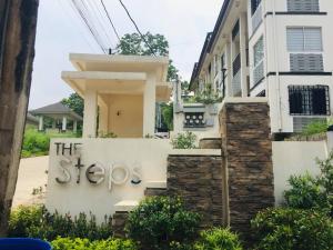 a house with a sign on the side of it at Mid-rise Condo in Antipolo by Casa Akiolo in Antipolo