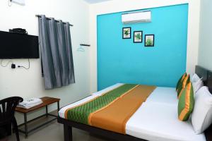 מיטה או מיטות בחדר ב-Royal Green - Airport Stay