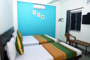 מיטה או מיטות בחדר ב-Royal Green - Airport Stay
