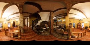 a large living room with aamed ceilings and a large living room at Casa Rural Garrido in Ademuz