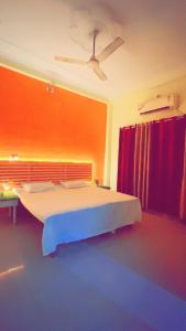 מיטה או מיטות בחדר ב-Rudra_HomeStay