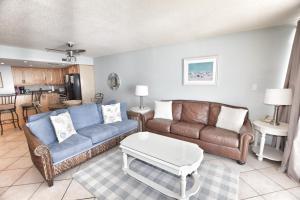a living room with a couch and a coffee table at 0611 Waters Edge Resort condo in Myrtle Beach
