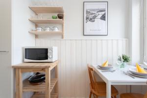 TV a/nebo společenská místnost v ubytování Aalto Aurora