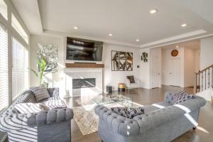 a living room with two couches and a fireplace at Aurora Vacation Rental about 18 Mi to Downtown Denver! in Aurora