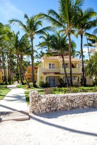 a house on the beach with palm trees at Los Corales Beach Village Punta Cana - The original in Punta Cana