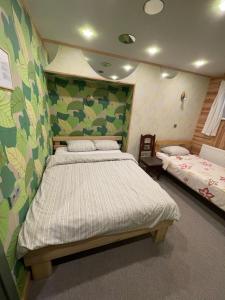 a bedroom with two beds in a room at Gintagnė in Aleksandrija