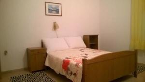 Postel nebo postele na pokoji v ubytování Apartments Mirjana + 23 fotografií