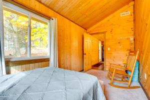 A bed or beds in a room at Cozy Howard Cabin Hike, Hunt and Fish!