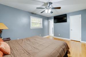 a bedroom with a bed and a ceiling fan at Quiet Decatur Home with Patio 13 Mi to Dtwn Atlanta! in Decatur