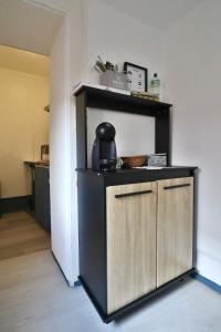 a kitchen with a counter with a tea kettle on it at Studio de 30m² hypercentre très calme in Montbéliard