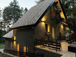 a brick house with a balcony and a fire escape at Rifugio Federici Home in Camigliatello Silano