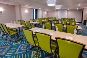 a classroom with tables and chairs in a room at Drury Inn & Suites Nashville Airport in Nashville
