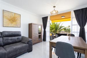 a living room with a couch and a table at Apartamento Clara in Los Cristianos