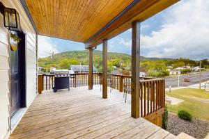 a wooden porch with a view of the mountains at Norris Villa 2 in La Follette