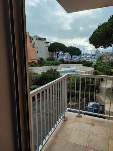 a balcony with a view of a pool at Studio Cap d'Agde in Cap d'Agde