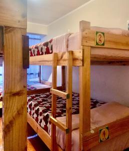 a couple of bunk beds in a room at Namaste House in Cusco