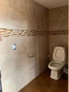 a bathroom with a toilet in a room at Casa completa para 8 en Coacalco SuperB in Mexico City