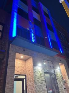 a building with blue lights on top of it at Moon Hotel Brooklyn in Brooklyn