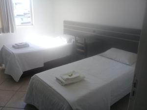 Cama o camas de una habitación en Hotel Parati