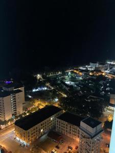 an aerial view of a city at night at ALEENA STAYCATION @ APARTMENT TOK PELAM PANTAI BATU BURUK in Kuala Terengganu