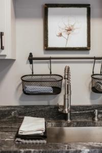 a kitchen counter with a sink and a towel at Greenway Garage with Firepit in Athens