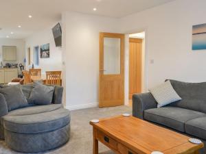 a living room with two couches and a coffee table at Trinity Avenue Cottage in Bridlington