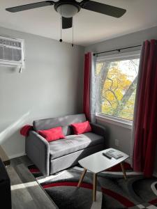 a living room with a couch and a window at Lake Shafer Resort in Monticello