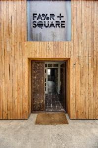 an entrance to a building with a sign on it at Hostel Fair and Square in Belgrade