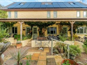 a house with solar panels on the roof at Clover Cottage- Uk45595 in Verwick